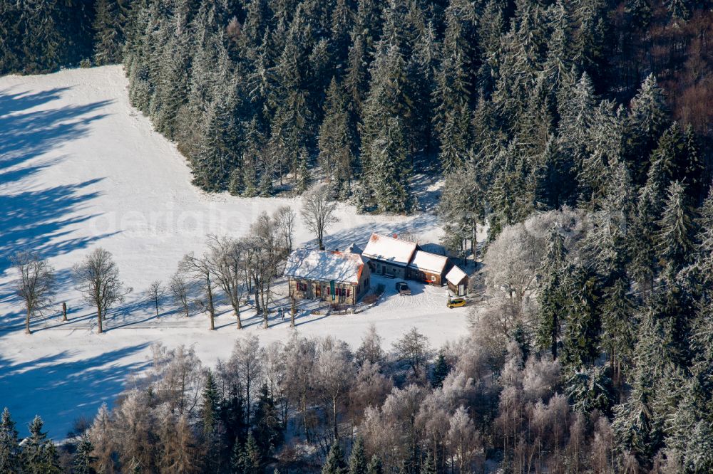 Erbendorf from the bird's eye view: Wintry snowy building of the restaurant Waldhaus in Steinwald in Erbendorf in the state Bavaria, Germany
