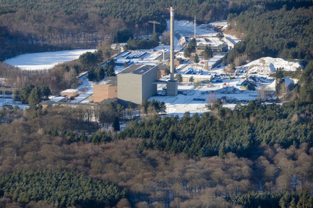 Rheinsberg from above - Wintry snowy building the decommissioned reactor units and systems of the NPP - NPP nuclear power plant in Rheinsberg in the state Brandenburg, Germany