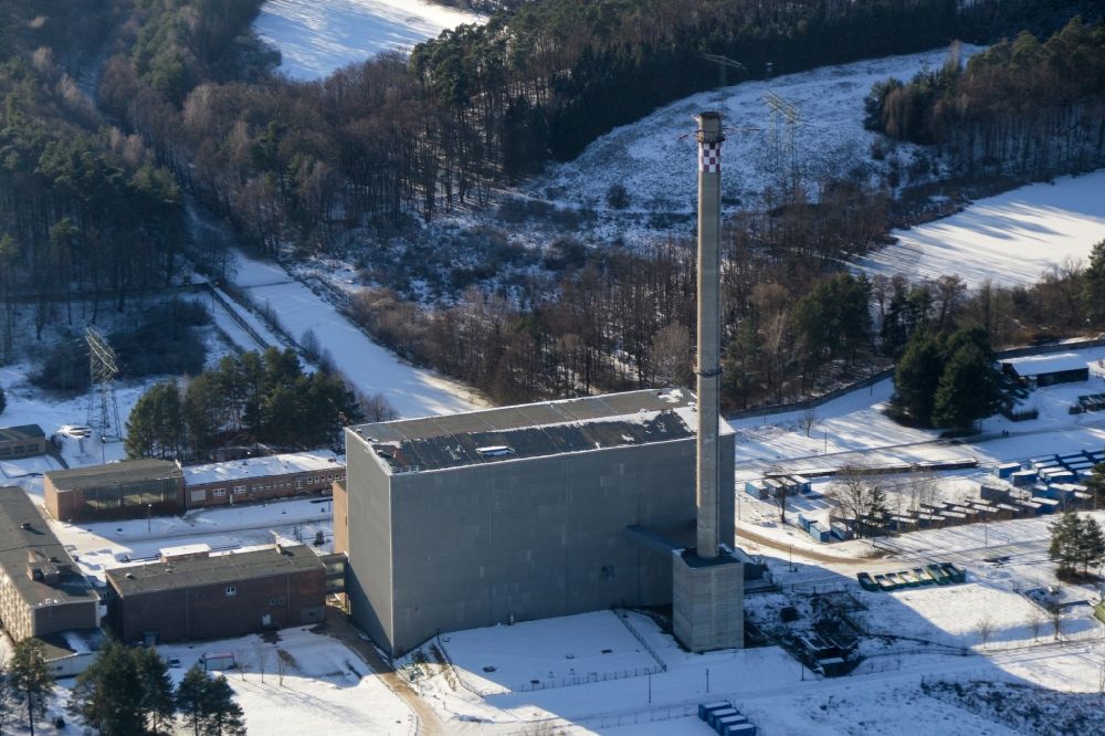 Rheinsberg from the bird's eye view: Wintry snowy building the decommissioned reactor units and systems of the NPP - NPP nuclear power plant in Rheinsberg in the state Brandenburg, Germany