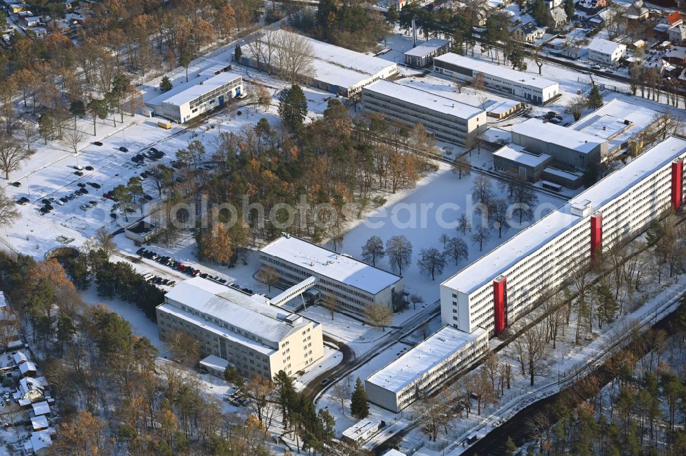 Aerial image Berlin - Wintry snowy building complex of the German army - Bundeswehr military barracks of the Planungsamt der Bundeswehr along the Oberspreestrasse in the district Niederschoeneweide in Berlin, Germany