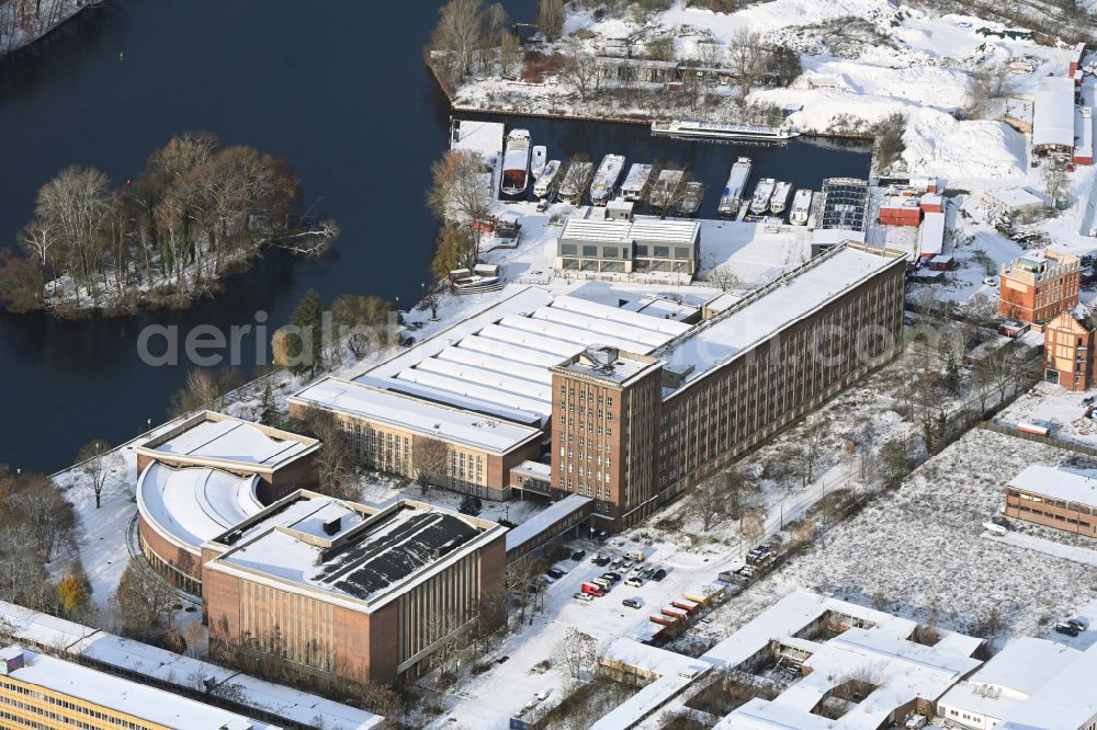 Berlin from above - Wintry snowy complex of buildings with satellite dishes on the transmitter broadcasting center Funkhaus Berlin Nalepastrasse on Nalepastrasse in the district Oberschoeneweide in Berlin, Germany