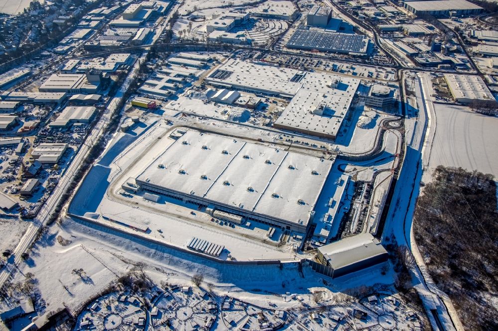Witten from the bird's eye view: Wintry snowy building complex and grounds of the logistics center with a new Amazon building on Menglinghauser Strasse - Siemensstrasse in the district Ruedinghausen in Witten at Ruhrgebiet in the state North Rhine-Westphalia, Germany
