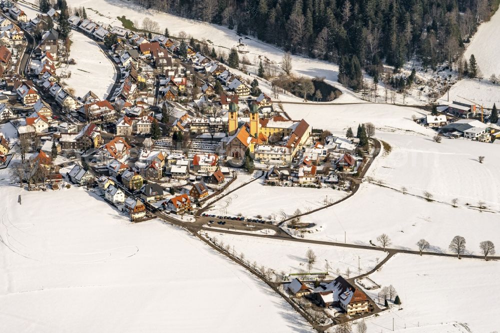 Sankt Märgen from the bird's eye view: Wintry snowy complex of buildings of the monastery in Sankt Maergen in the state Baden-Wurttemberg, Germany