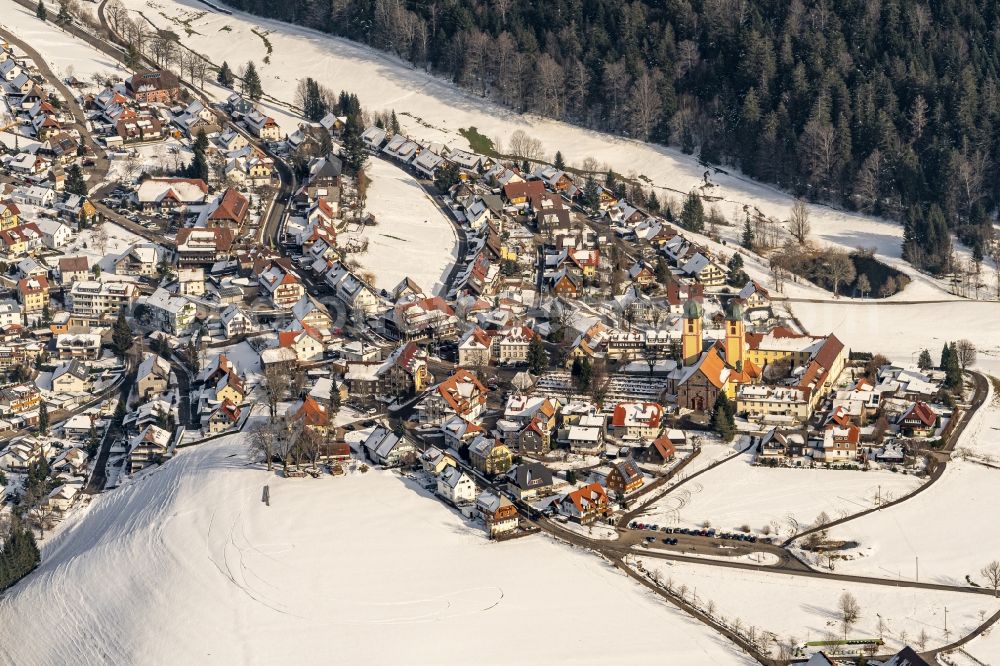 Aerial image Sankt Märgen - Wintry snowy complex of buildings of the monastery in Sankt Maergen in the state Baden-Wurttemberg, Germany