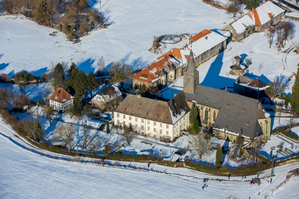Aerial image Arnsberg - Wintry snowy Complex of buildings of the monastery Oelinghausen in the district Holzen in Arnsberg in the state North Rhine-Westphalia