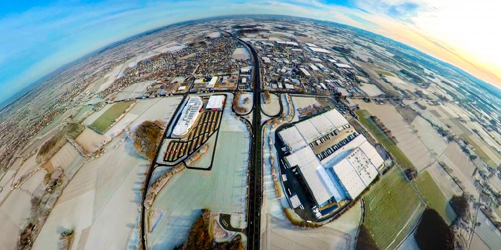 Rhynern from the bird's eye view: Wintry snow-covered building complex and logistics center on the site Edeka Zentrallager in Thynern in the state North Rhine-Westphalia, Germany