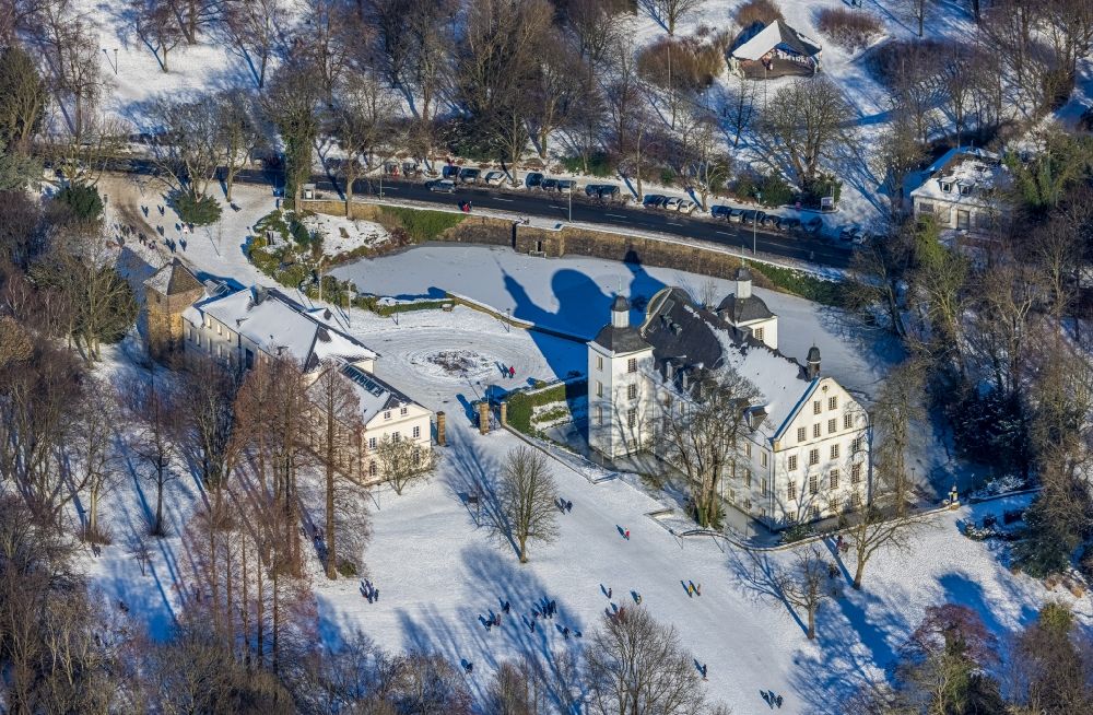 Essen from above - Wintry snowy building complex in the park of the castle Borbeck in Essen in the state North Rhine-Westphalia, Germany