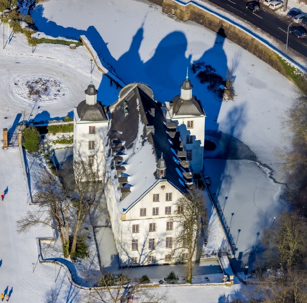 Essen from above - Wintry snowy building complex in the park of the castle Borbeck in Essen in the state North Rhine-Westphalia, Germany
