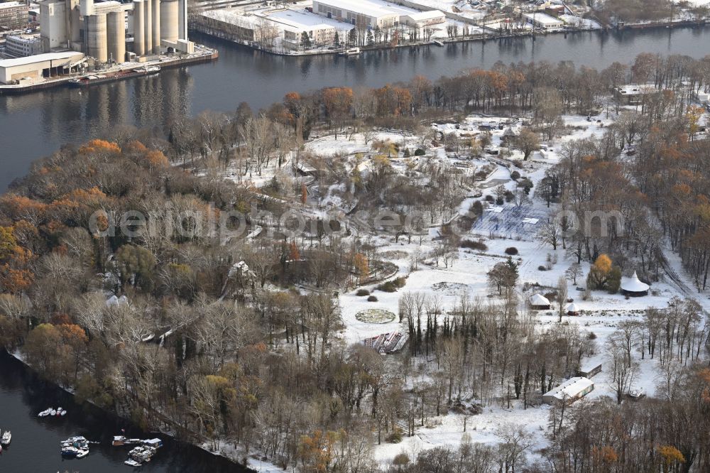 Berlin from above - Wintry snowy grounds of the derelict former amusement Culture park Plaenterwald in the district of Treptow in Berlin