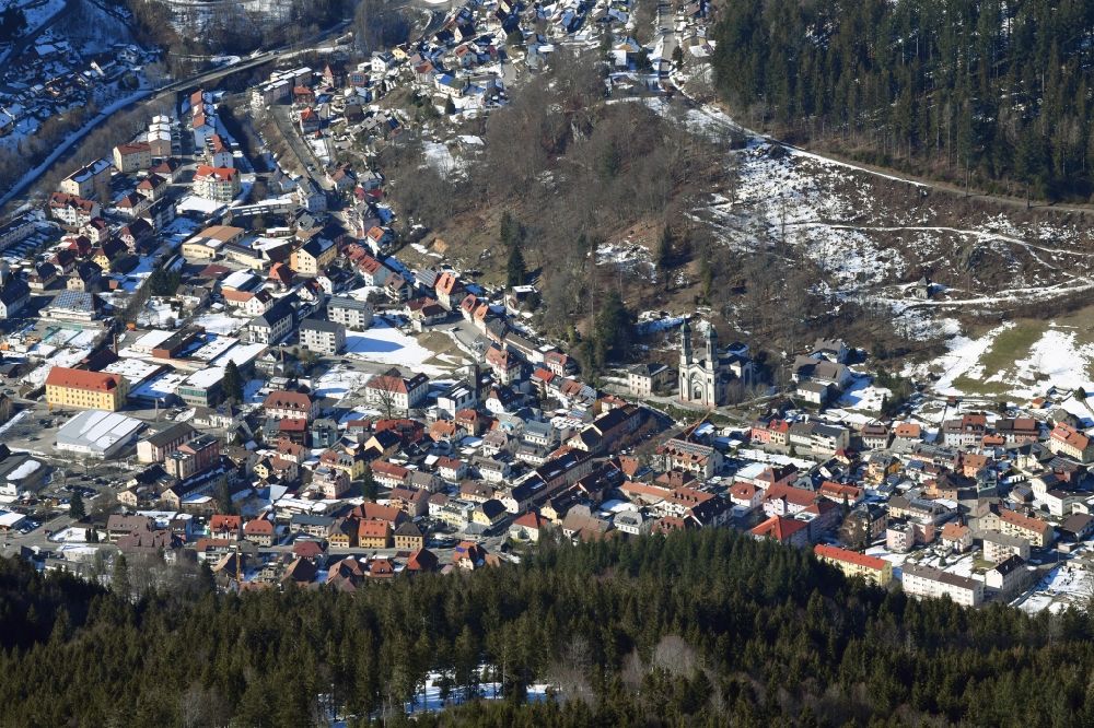 Todtnau from the bird's eye view: Wintry snowy city area of Todtnau with Catholic St. Johannes Baptist Church in the Black Forest in the state Baden-Wurttemberg, Germany