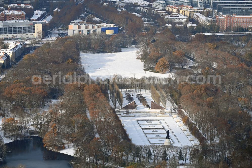 Berlin from above - Wintry snowy tourist attraction of the historic monument Sowjetisches Ehrenmal Treptow in Berlin, Germany