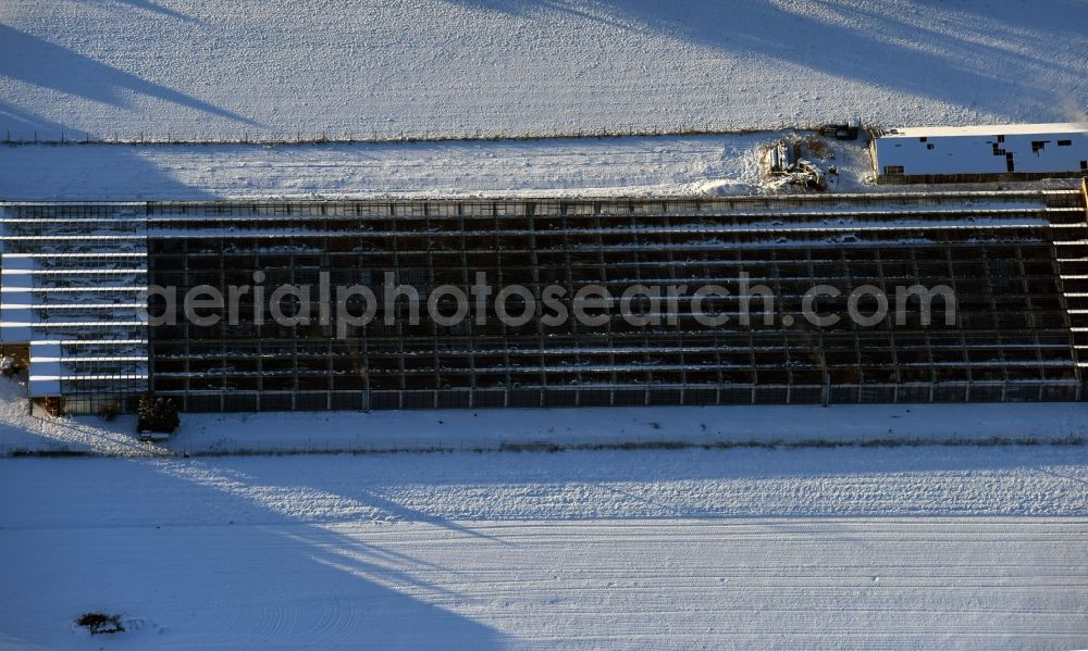 Altlandsberg from above - Wintry snowy glass roof surfaces in the greenhouse for vegetable growing ranks in Altlandsberg in the state Brandenburg