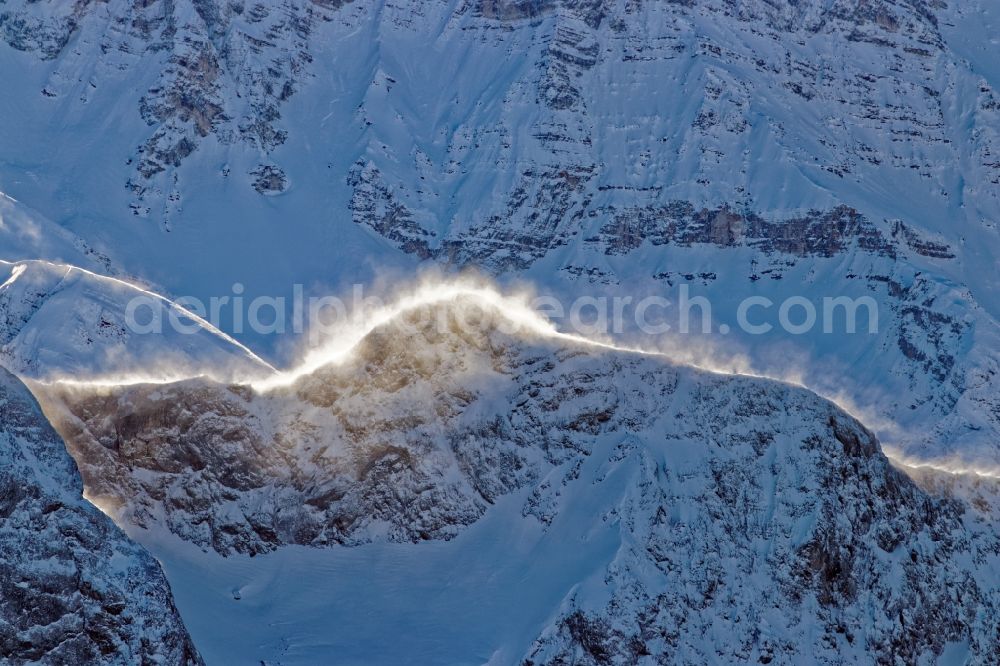 Leutasch from the bird's eye view: Winter aerial view Peaks and ridges with snowdrifts in the backlight in the rock and mountain landscape of the Alps near Seefeld in Tirol in Austria