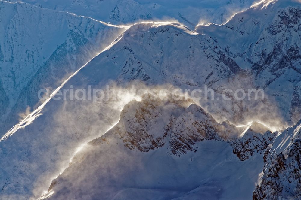 Leutasch from above - Winter aerial view Peaks and ridges with snowdrifts in the backlight in the rock and mountain landscape of the Alps near Seefeld in Tirol in Austria