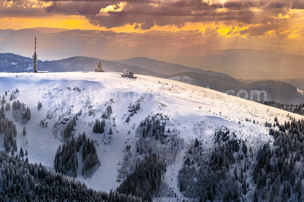 Aerial image Feldberg (Schwarzwald) - Wintry snowy mountainous landscape of the summit of Feldberg mountain at the World Cup of Ski Cross in Feldberg (Schwarzwald) in the state Baden-Wurttemberg, Germany. Looking over the Feldberg tower to the mountains Belchen and Hochblauen
