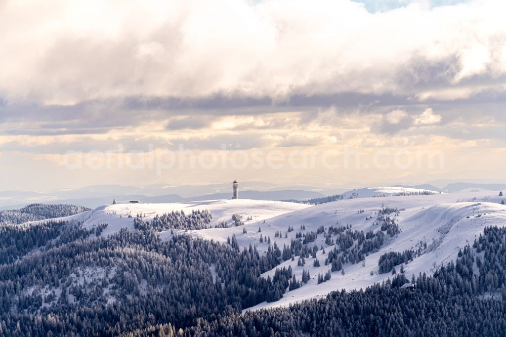 Aerial photograph Feldberg (Schwarzwald) - Wintry snowy mountainous landscape of the summit of Feldberg mountain at the World Cup of Ski Cross in Feldberg (Schwarzwald) in the state Baden-Wurttemberg, Germany. Looking over the Feldberg tower to the mountains Belchen and Hochblauen