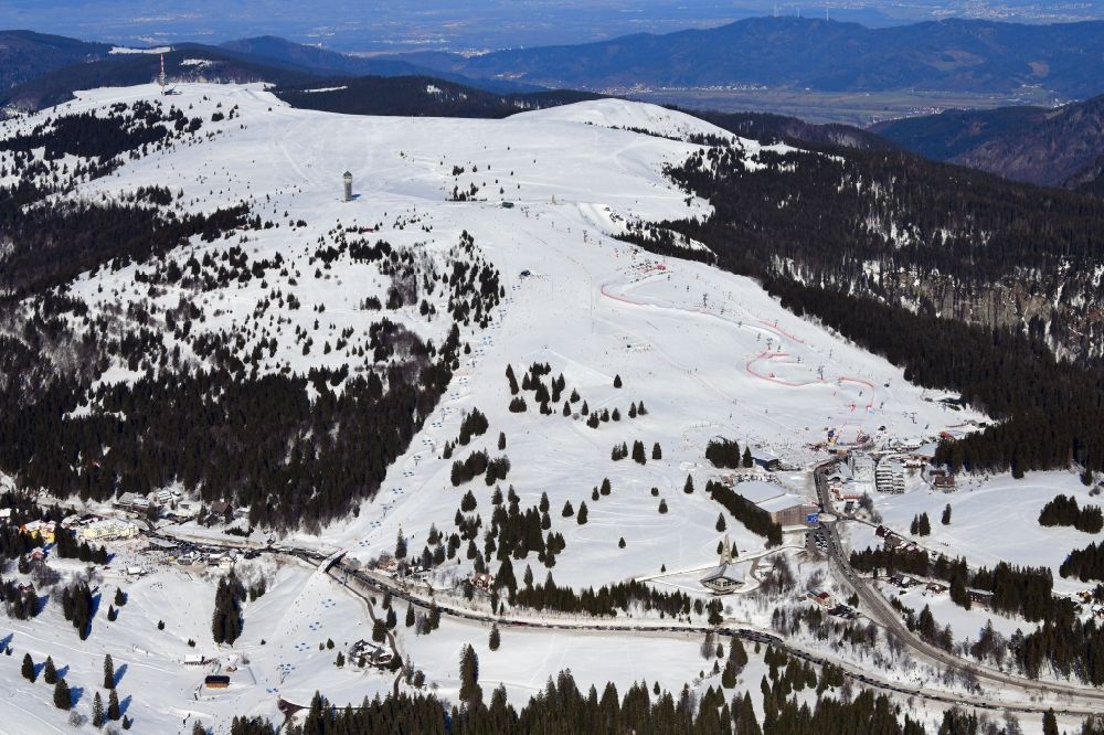 Aerial image Feldberg (Schwarzwald) - Wintry snowy mountainous landscape of the summit of Feldberg mountain with the ski sports area and parcour at the World Cup of Ski Cross in Feldberg (Schwarzwald) in the state Baden-Wurttemberg, Germany