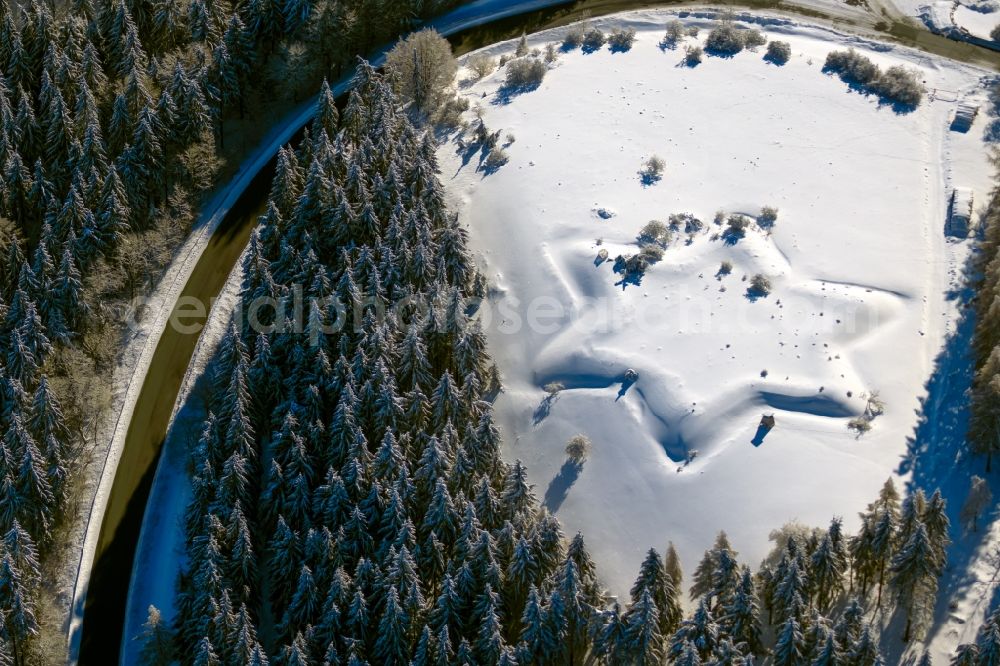 Aerial image Gersfeld (Rhön) - Wintry snowy structures of a field landscape of star-shaped Schwedenschanze in Gersfeld (Rhoen) in the state Hesse, Germany