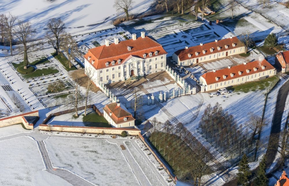 Aerial image Meseberg - Wintry snowy castle Meseberg the Federal Government on the banks of Huwenowsees in the town district Meseberg in Brandenburg