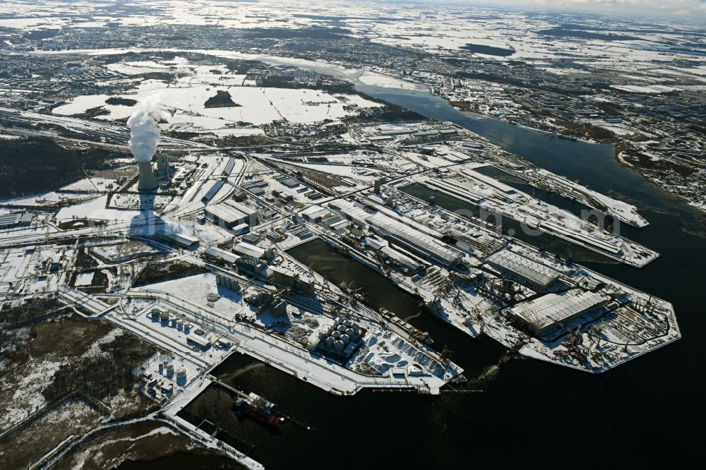 Rostock from above - Wintry snowy port facilities on the shores of the harbor of of Seehafen of ROSTOCK PORT GmbH in the district Peez in Rostock at the baltic sea coast in the state Mecklenburg - Western Pomerania, Germany