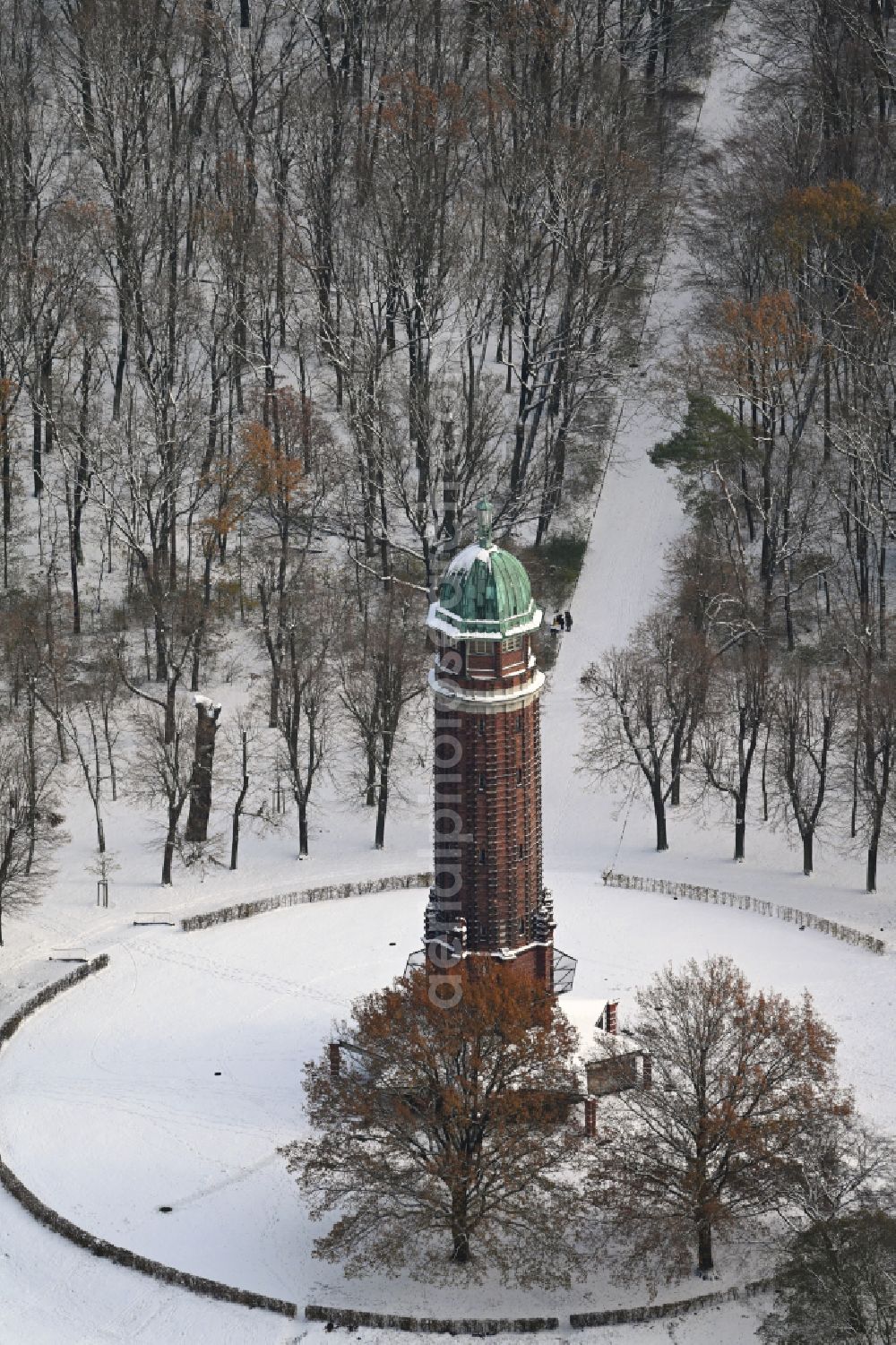 Aerial image Berlin - Wintry snowy building of the industrial monument water tower in the summer garden Jungfernheide with the open-air restaurant summer garden Jungfernheide in Berlin, Germany