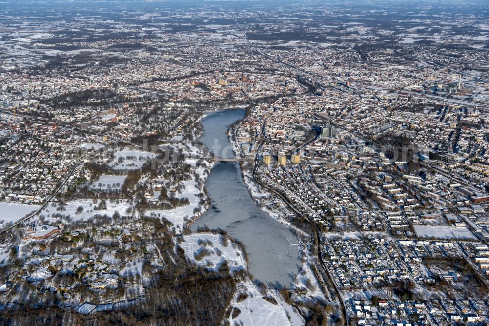 Münster from above - Wintry snowy city view of the downtown area on the shore areas of Aasee in the district Aaseestadt in Muenster in the state North Rhine-Westphalia, Germany