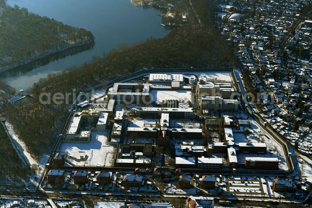 Berlin from above - Wintry snowy prison grounds and high security fence Prison Tegel on Seidelstrasse in the district Reinickendorf in Berlin, Germany