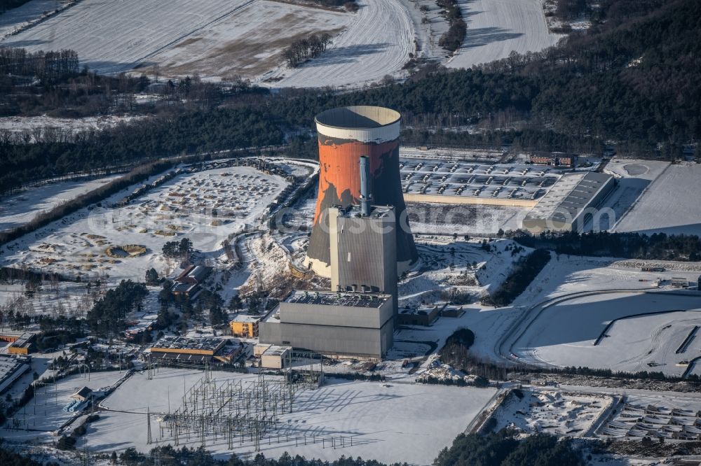 Aerial image Meppen - Wintry snowy cooling tower on the site of the former power station Meppen-Huentel in Lower Saxony