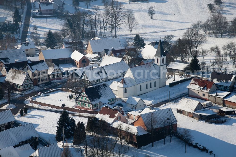 Aerial image Eberbach-Seltz - Wintry snowy Church building in the village of in Eberbach-Seltz in Grand Est, France