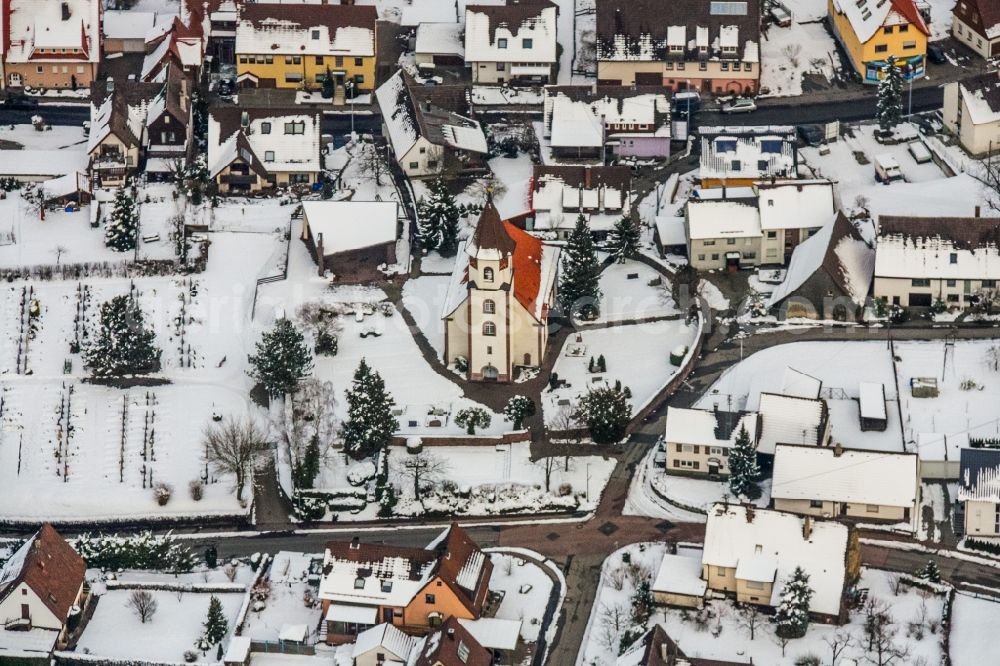 Straubenhardt from the bird's eye view: Wintry snowy Church building Evangelic Church in Ottenhausen in the state Baden-Wurttemberg, Germany