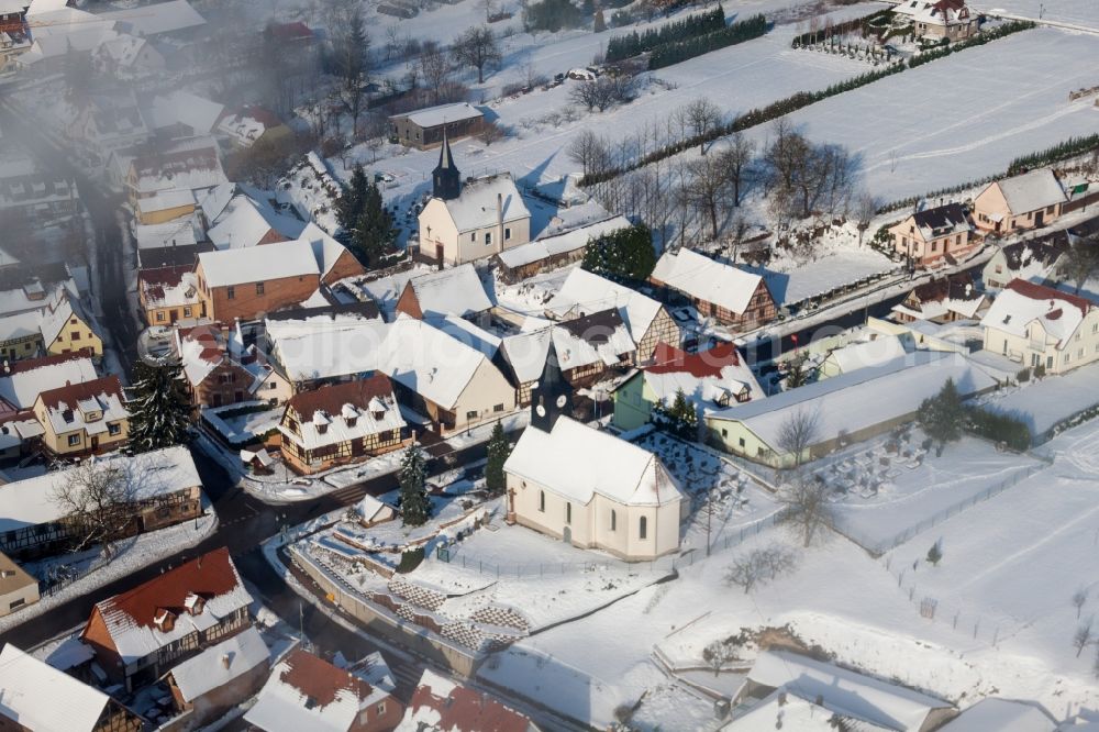 Aerial photograph Wintzenbach - Wintry snowy Church building Eglise protestante de Wintzenbach in Wintzenbach in Grand Est, France