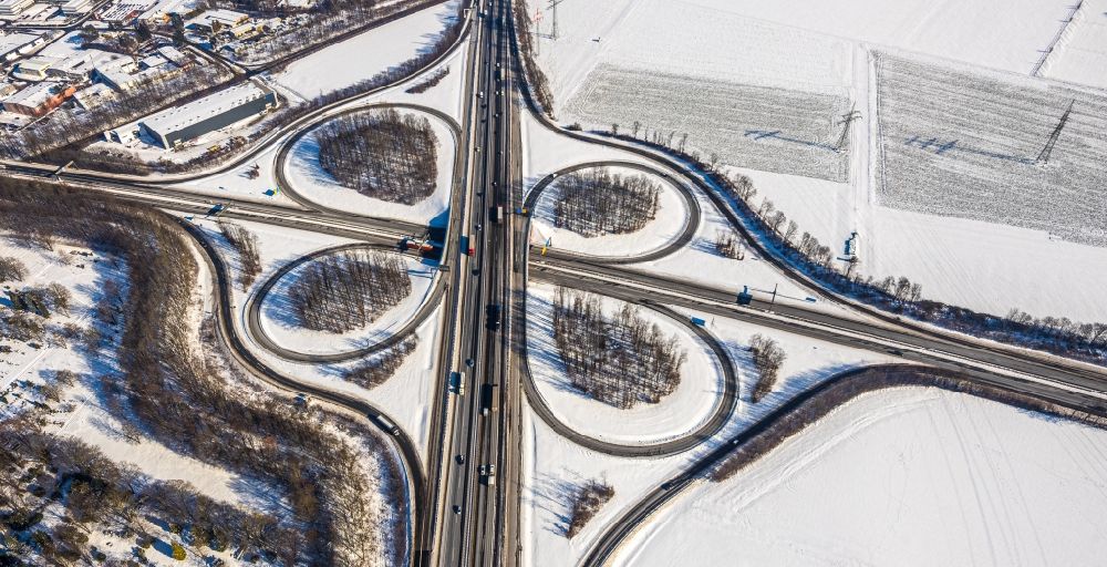 Unna from above - Wintry snowy traffic flow at the intersection- motorway A4 , A1 Kreuz Dortmund/Unna in form of cloverleaf in Unna in the state North Rhine-Westphalia, Germany