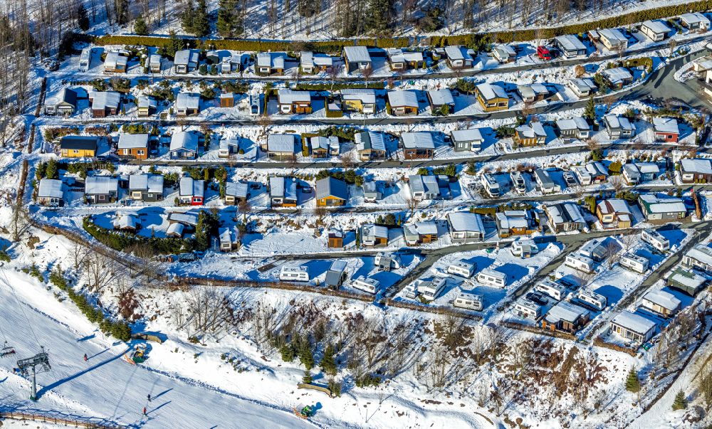 Aerial photograph Winterberg - Wintry snowy allotment gardens and cottage settlement Bikepark on street Kapperundweg in Winterberg at Sauerland in the state North Rhine-Westphalia, Germany