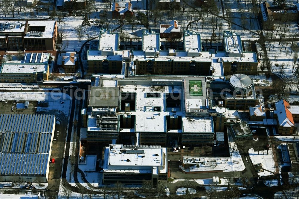 Berlin from above - Wintry snowy hospital grounds of the accident clinic in the district Marzahn-Hellersdorf in Berlin
