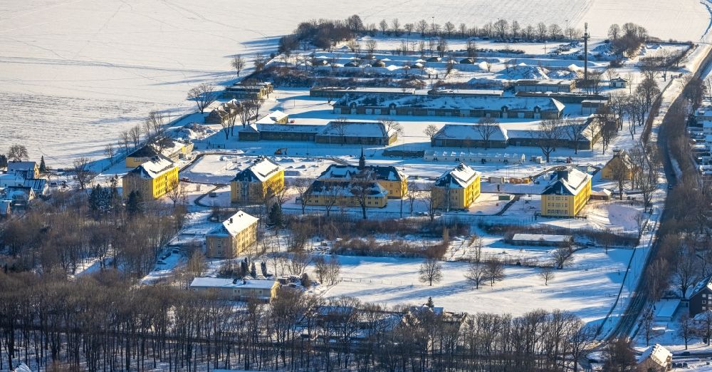 Aerial photograph Soest - Wintry snowy conversion construction site Building complex of the former military barracks in Soest in the state of North Rhine-Westphalia, Germany