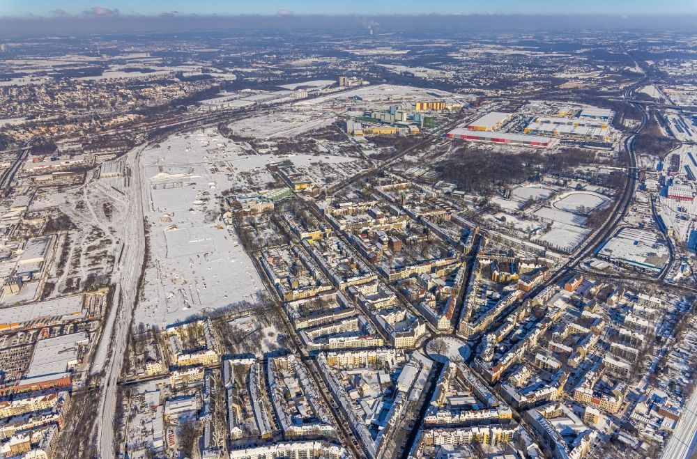 Dortmund from the bird's eye view: Wintry snowy traffic management of the roundabout road Borsigstrasse - Wambeler Strasse in the district Borsigplatz in Dortmund in the state North Rhine-Westphalia, Germany