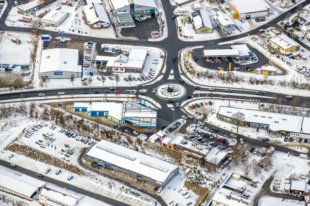 Aerial photograph Winterberg - Wintry snowy traffic management of the roundabout road Haarfelder Strasse - Remmeswiese - Am Hagenblech in Winterberg at Sauerland in the state North Rhine-Westphalia, Germany
