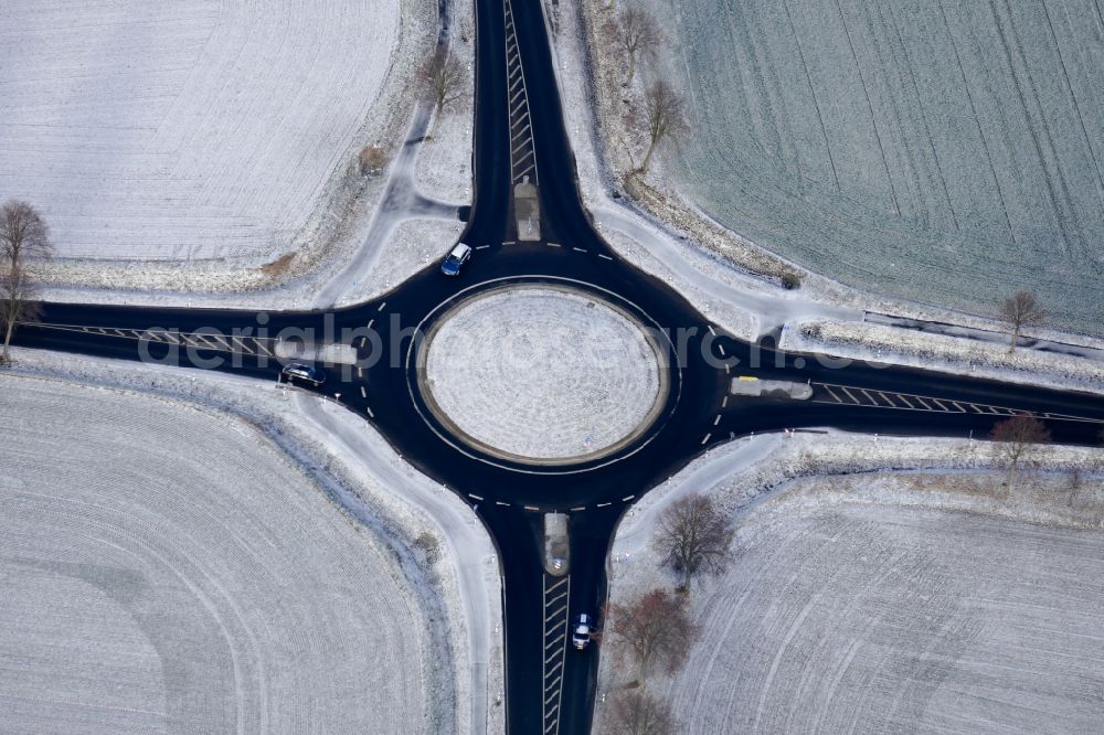Aerial image Rosdorf - Wintry snowy traffic management of the roundabout road in Rosdorf in the state Lower Saxony, Germany