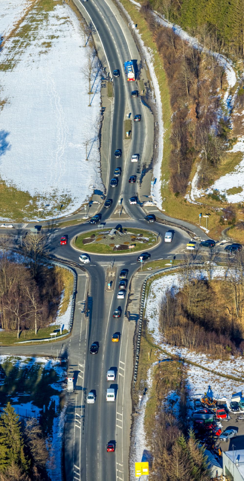 Winterberg from above - Wintry snowy traffic management of the roundabout road on street Haarfelder Strasse in Winterberg at Sauerland in the state North Rhine-Westphalia, Germany