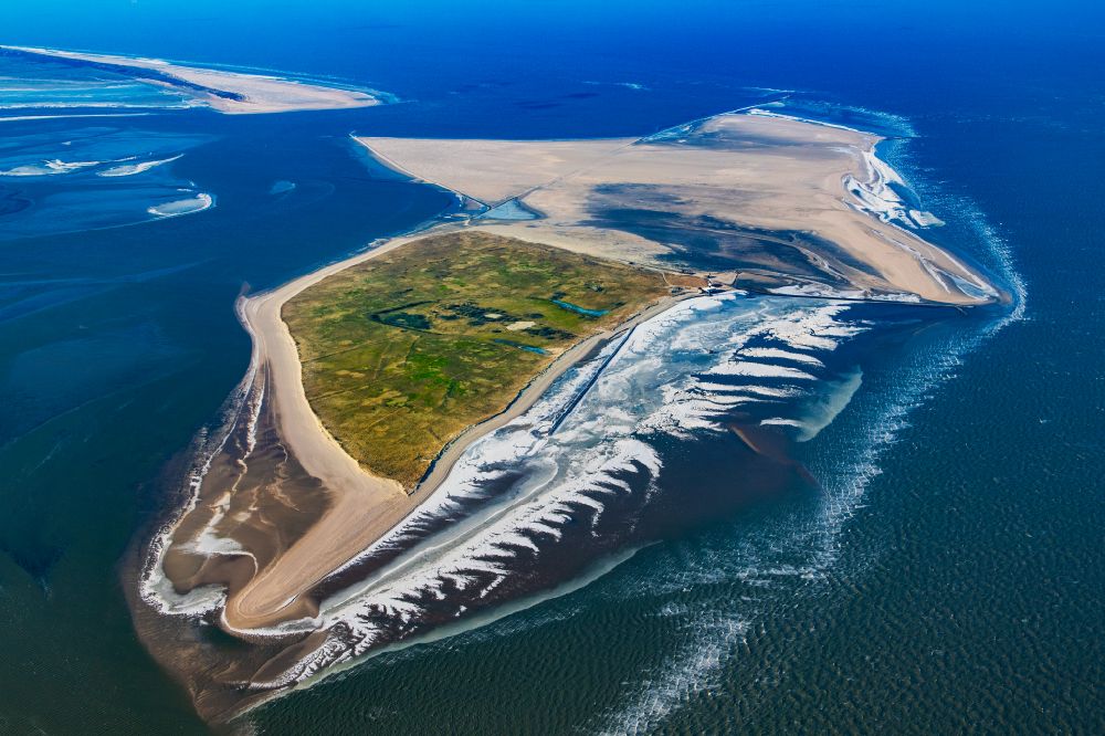Wangerland from above - Wintry snowy coastal area of the Minsener Oog North Sea - Island in Wangerland in the state Lower Saxony