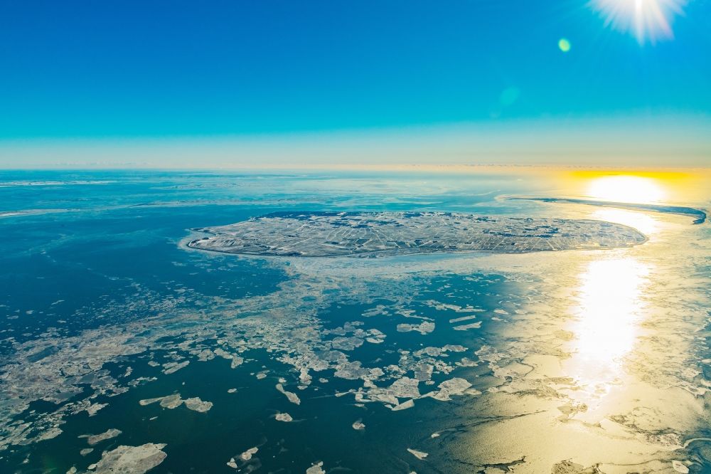 Föhr from the bird's eye view: Wintry snowy coastal area of a??a??the North Frisian North Sea island Foehr in sunrise in the state Schleswig-Holstein, Germany