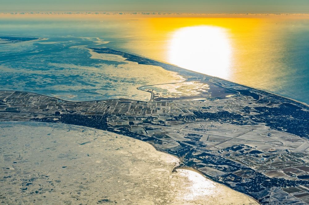 Sylt from above - Wintry snowy coastal area of North Sea - Island by Sunset in Sylt in the state Schleswig-Holstein, Germany