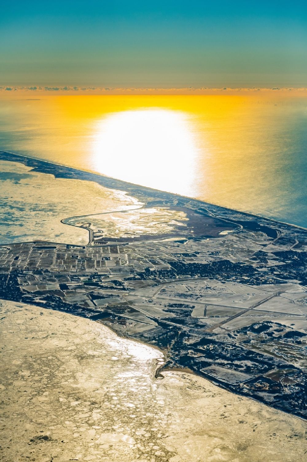 Sylt from the bird's eye view: Wintry snowy coastal area of North Sea - Island by Sunset in Sylt in the state Schleswig-Holstein, Germany
