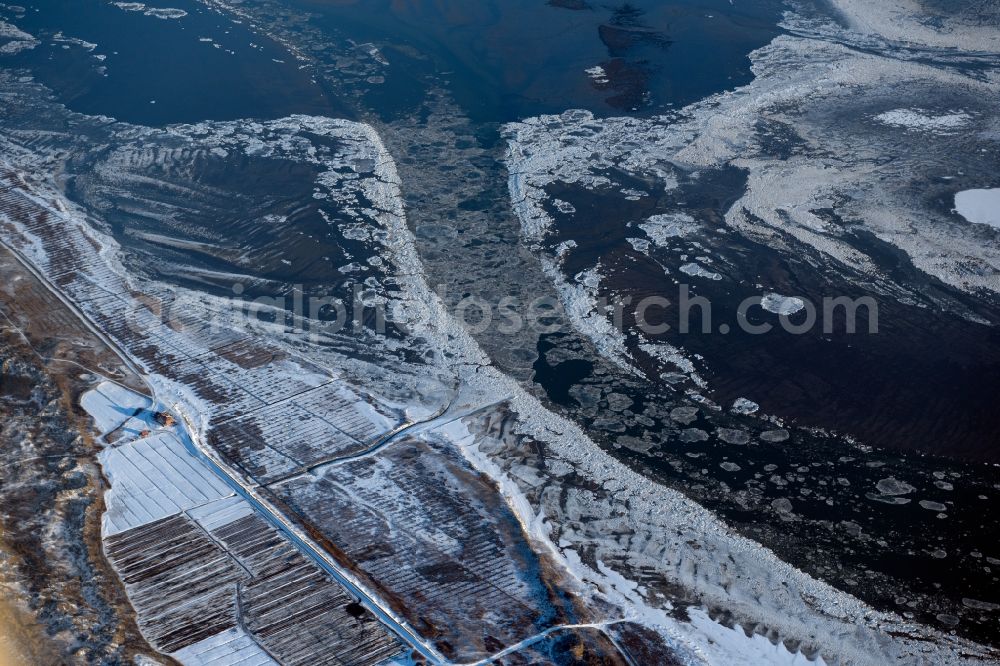 Juist from the bird's eye view: Wintry snow-covered coastal area at the western end of the North Sea - the island of Juist in the state of Lower Saxony, Germany