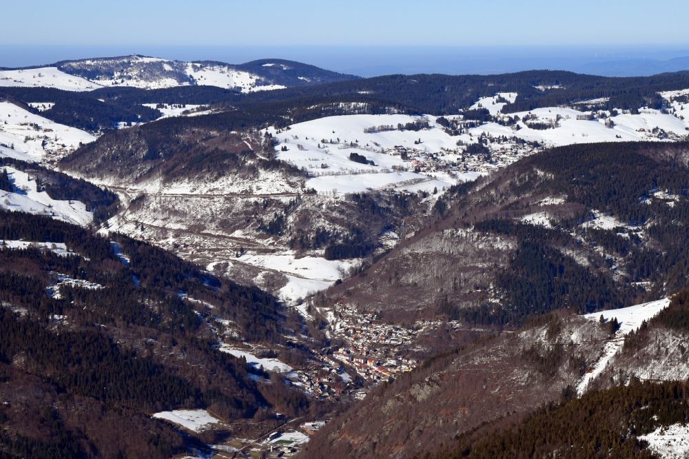 Todtnau from the bird's eye view: Wintry snowy mountains of the Black Forest and city area of Todtnau and district Todtnauberg in the Black Forest in the state Baden-Wurttemberg, Germany