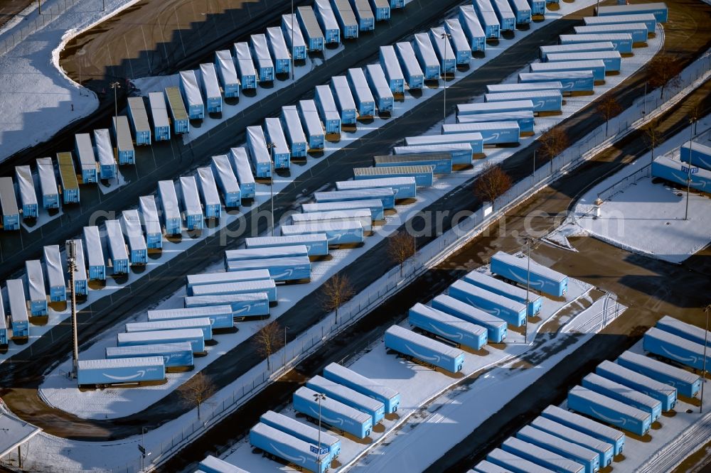 Aerial image Leinfelden-Echterdingen - Wintry snowy truck trailer parking spaces and open space warehouse from Amazon on the exhibition parking lots in Leinfelden-Echterdingen in the state Baden-Wuerttemberg, Germany
