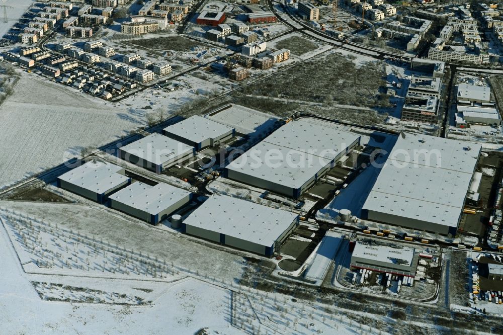 Schönefeld from the bird's eye view: Wintry snowy construction site to build a new building complex on the site of the logistics center of Verdion Airpark Berlin An den Gehren in Schoenefeld in the state Brandenburg, Germany