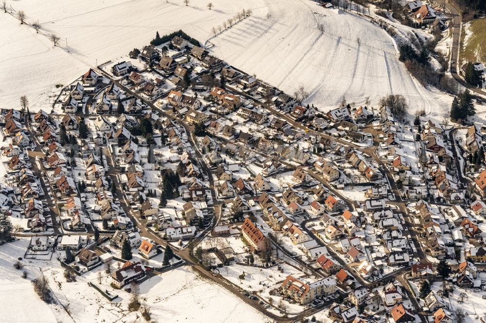 Aerial image Sankt Peter - Wintry snowy residential area construction site of a mixed development with multi-family houses and single-family houses- New building at the in Sankt Peter in the state Baden-Wurttemberg, Germany