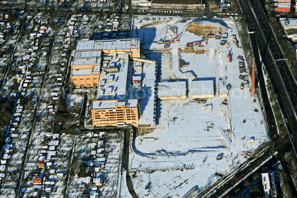Berlin from above - Wintry snowy new building construction site in the industrial park Gewerbehoefequartier Go West on street Forckenbeckstrasse in the district Schmargendorf in Berlin, Germany