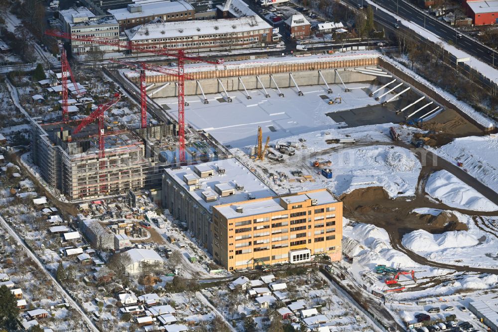 Berlin from above - Wintry snowy new building construction site in the industrial park Gewerbehoefequartier Go West on street Forckenbeckstrasse in the district Schmargendorf in Berlin, Germany